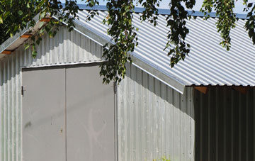 repairing Charles Tye metal garage roofing